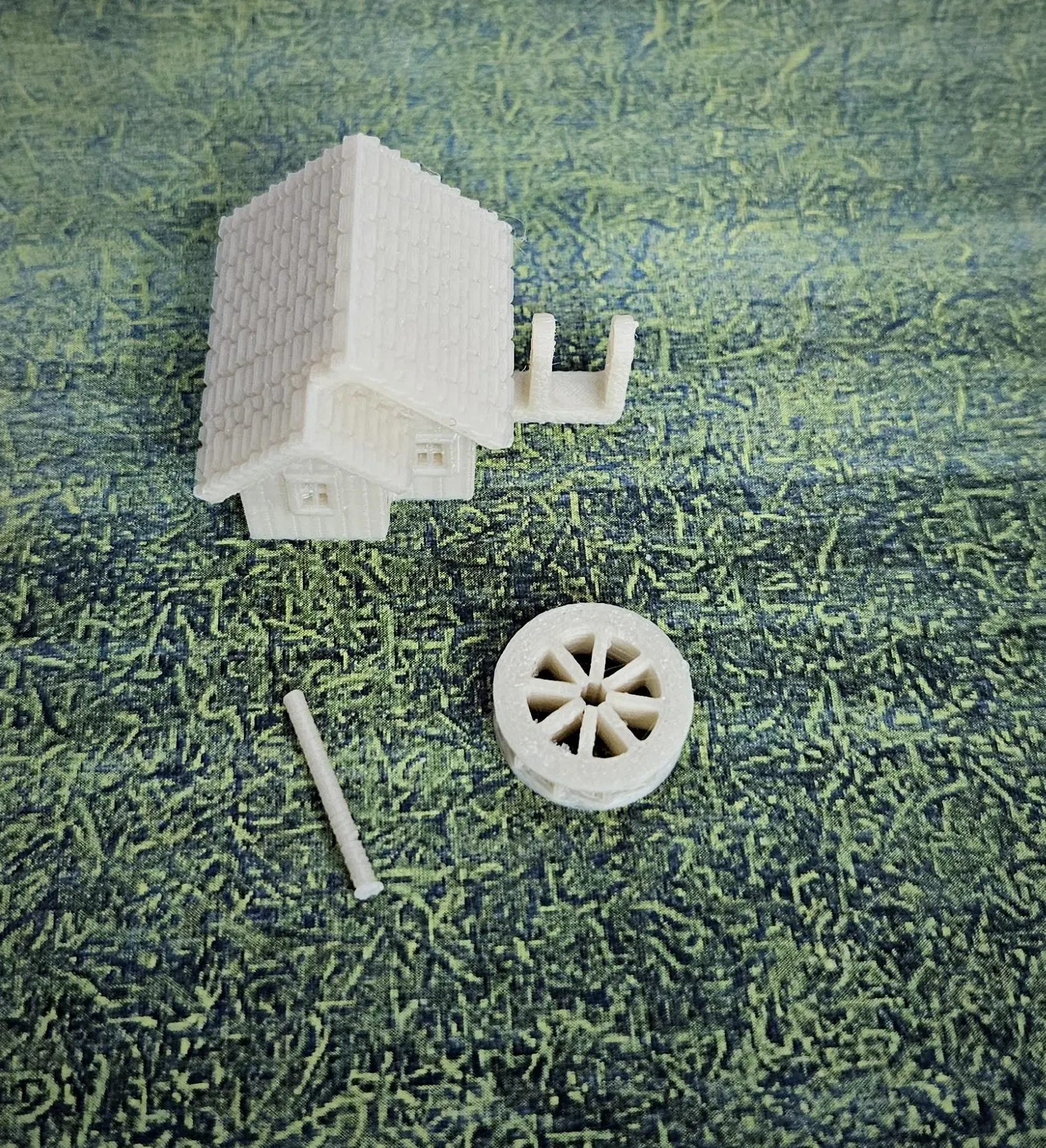 Close-up of rotating waterwheel on N scale small building kit